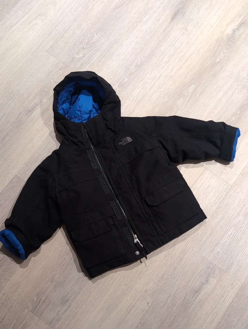 The North Face Kids Black Fall And Winter Jacket with Blue Lining